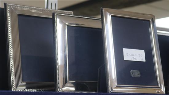Three assorted 1990s silver mounted rectangular photograph frames, largest 23cm.